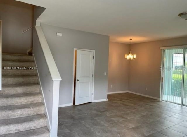 interior space featuring tile patterned floors and a chandelier