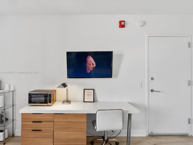 office with light hardwood / wood-style floors