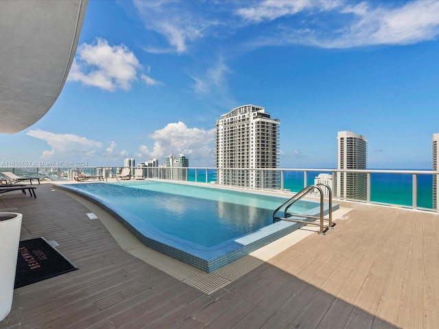 view of pool featuring a water view