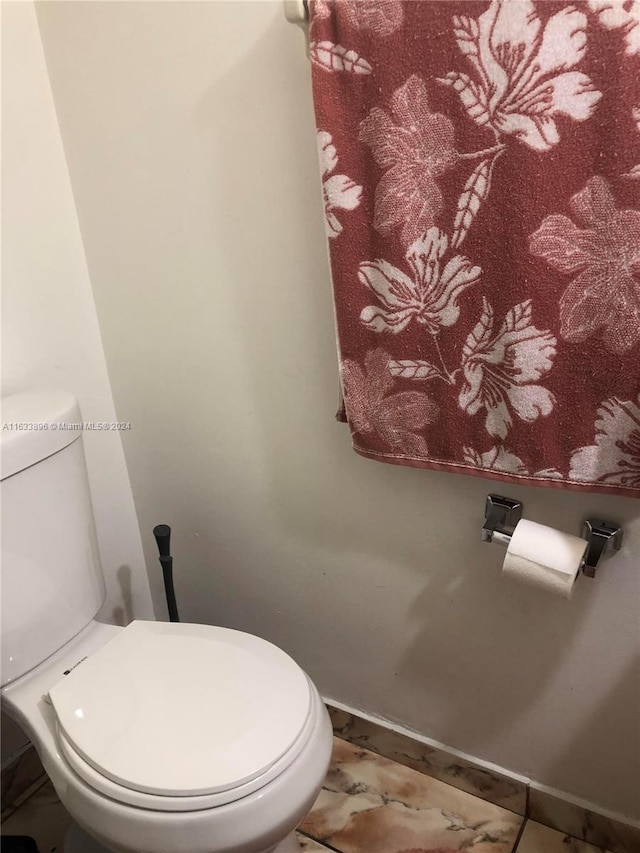 16700 NW 55th Ave Unit 12, Miami Gardens, FL 33055 - bathroom with toilet and baseboards