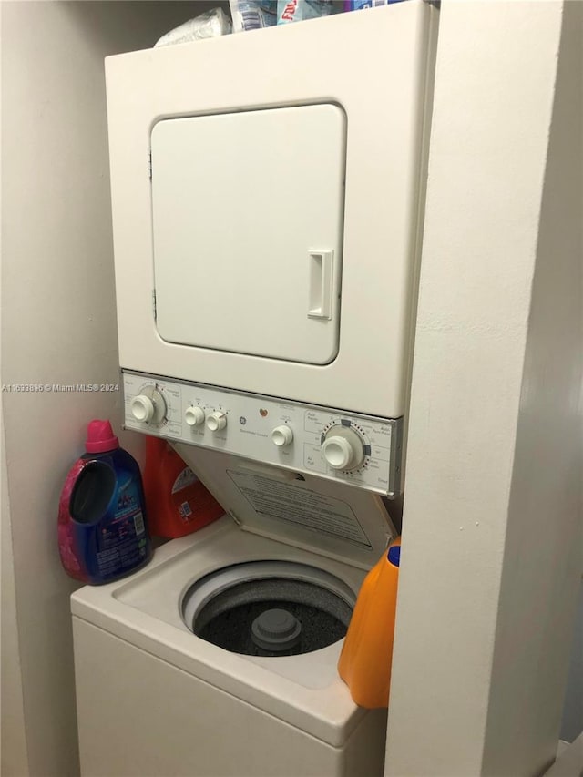 16700 NW 55th Ave Unit 12, Miami Gardens, FL 33055 - laundry area featuring stacked washer and dryer and laundry area
