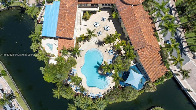 birds eye view of property with a water view