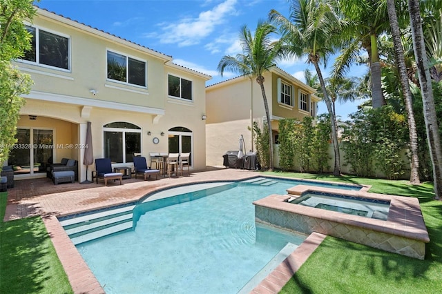 view of pool featuring an outdoor hangout area, a patio, and an in ground hot tub