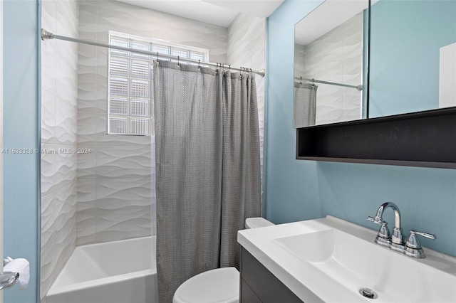 full bathroom with vanity, shower / bath combination with curtain, and toilet