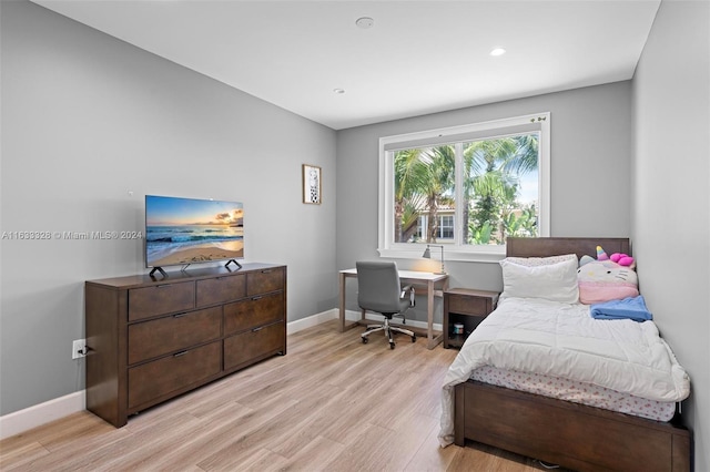 bedroom with light wood-type flooring