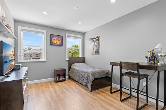 bedroom with light hardwood / wood-style flooring