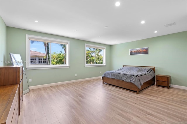 bedroom with light hardwood / wood-style flooring