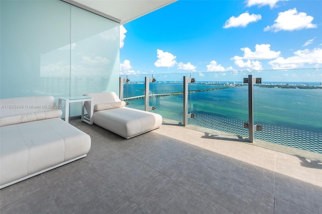 balcony featuring a water view