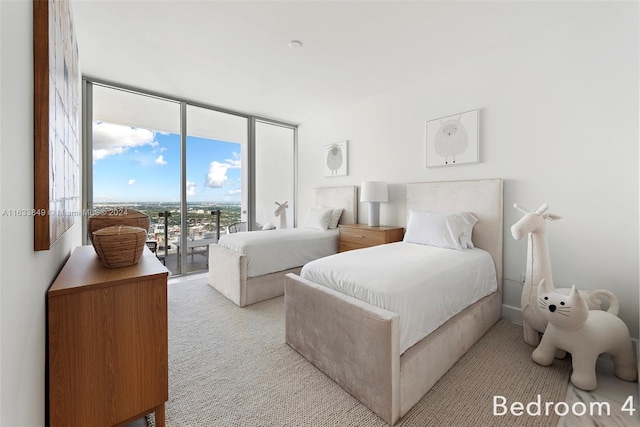 carpeted bedroom with access to exterior and floor to ceiling windows