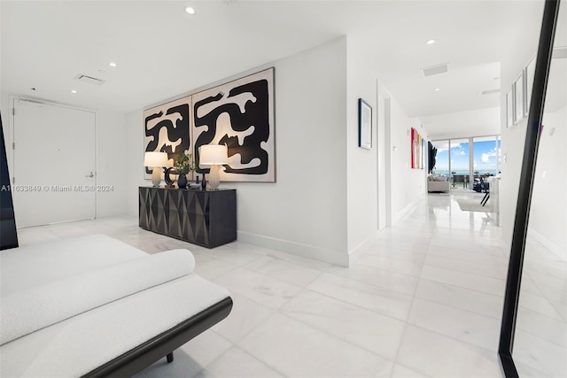 corridor with baseboards and recessed lighting