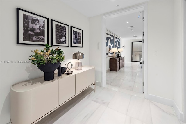 hallway featuring light tile patterned floors