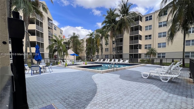 view of swimming pool featuring a patio area