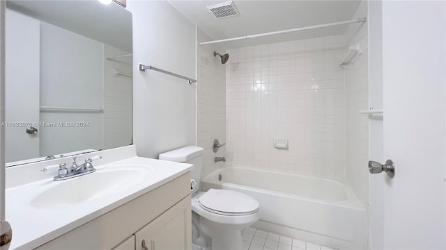 full bathroom featuring vanity, toilet, tile patterned floors, and tiled shower / bath