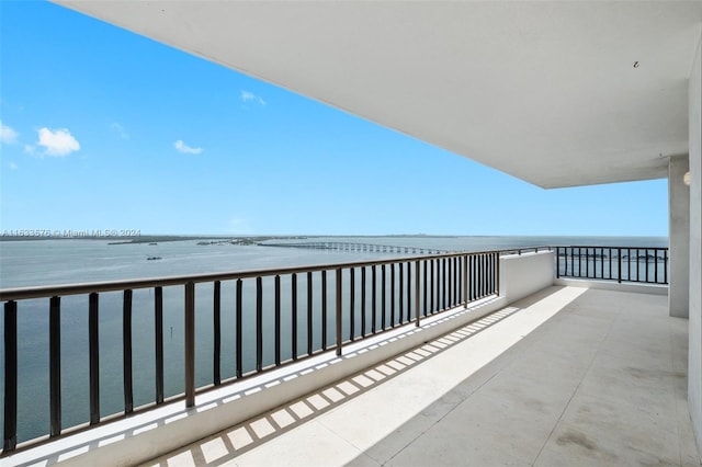 balcony featuring a water view