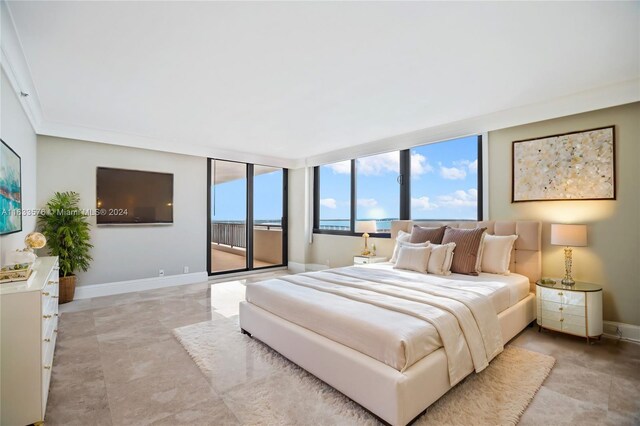 bedroom with light tile patterned flooring, access to exterior, ornamental molding, and a wall of windows