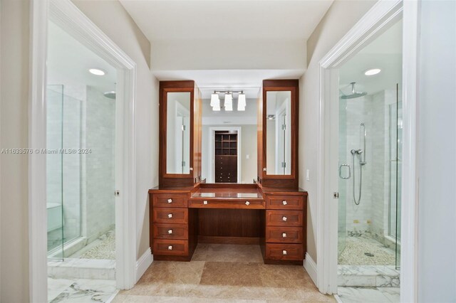 bathroom featuring tile patterned floors, vanity, and an enclosed shower