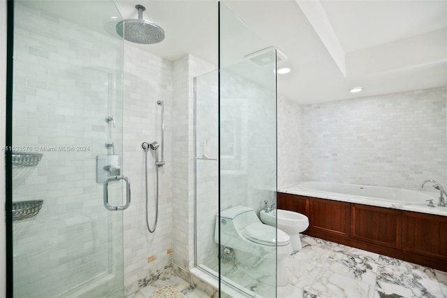 bathroom featuring a garden tub, a shower stall, and tile walls