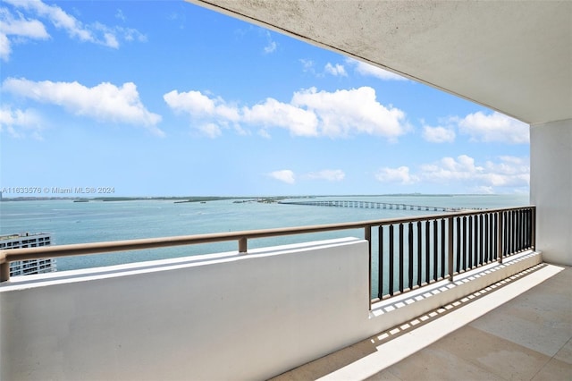 balcony featuring a water view