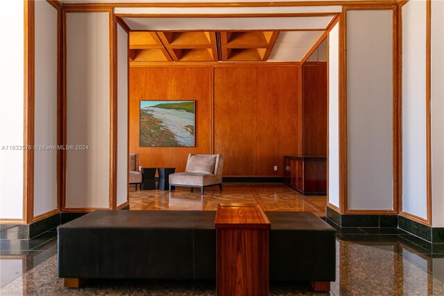 tiled living room with wood walls