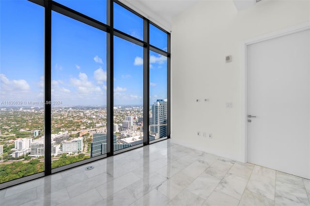 empty room with floor to ceiling windows