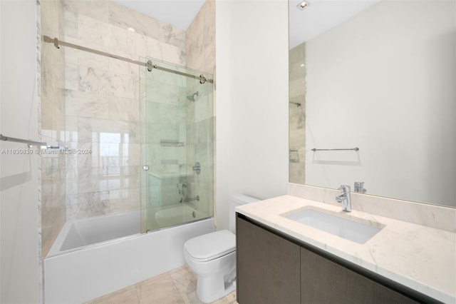 full bathroom with vanity, combined bath / shower with glass door, and toilet