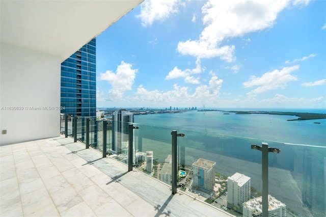 balcony featuring a water view