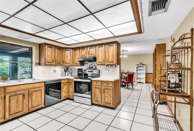 kitchen featuring light tile patterned flooring, dishwasher, sink, and stainless steel electric range