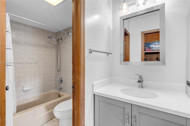 full bathroom with vanity, toilet, and shower / bath combo with shower curtain