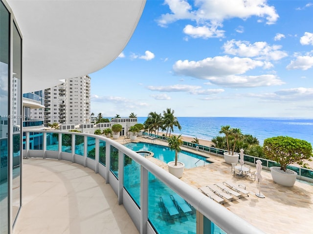 balcony featuring a water view