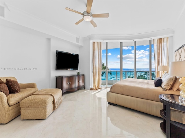 bedroom featuring access to outside, ceiling fan, and a wall of windows