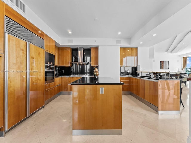 kitchen with stainless steel oven, paneled built in fridge, wall chimney exhaust hood, tasteful backsplash, and a kitchen island