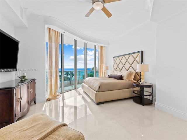 bedroom featuring ceiling fan, expansive windows, and access to exterior