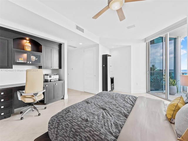 bedroom featuring built in desk, access to outside, and ceiling fan