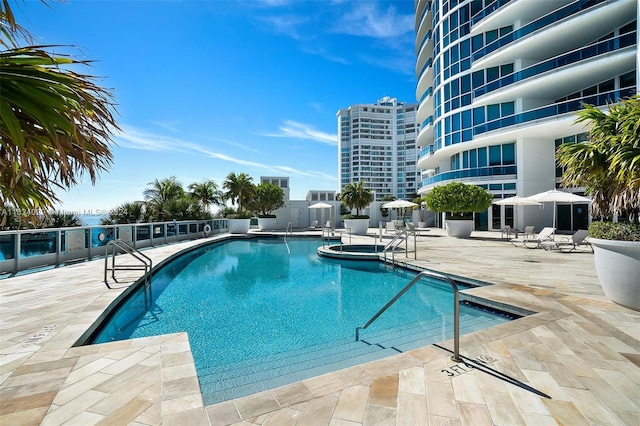 view of swimming pool featuring a patio area