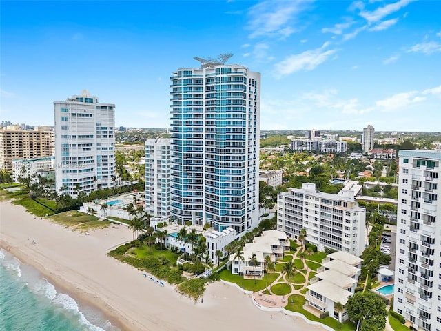 view of building exterior featuring a view of the beach and a water view