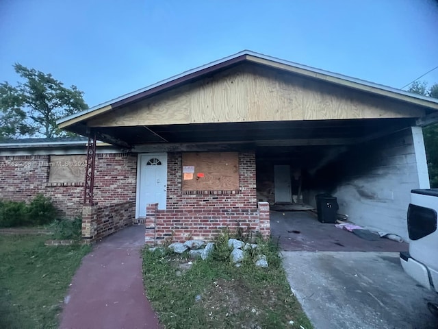 bungalow-style home with a carport