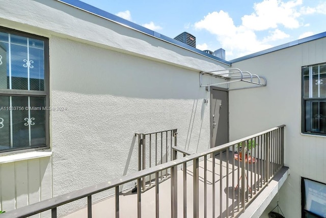 exterior space featuring central AC unit and a balcony