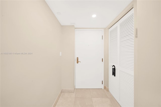 5757 Collins Ave Unit 801, Miami Beach, FL 33140 - hallway with baseboards and light tile patterned floors