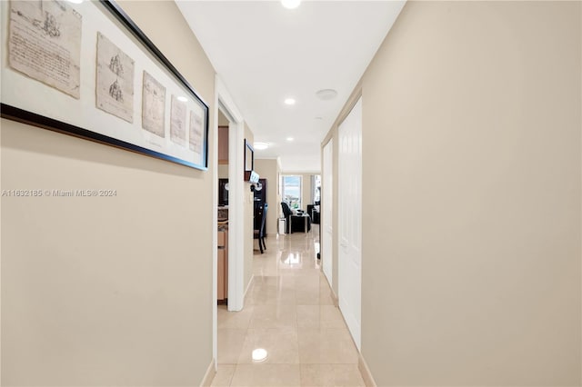 hallway with light tile patterned floors