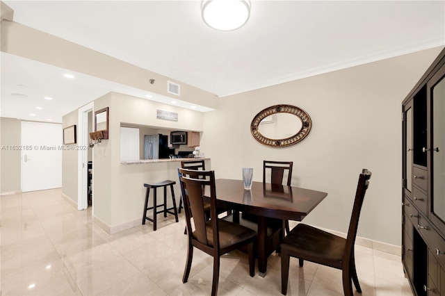 5757 Collins Ave Unit 801, Miami Beach, FL 33140 - dining space featuring baseboards, crown molding, and recessed lighting