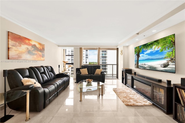 living room with ornamental molding, light tile patterned floors, and floor to ceiling windows