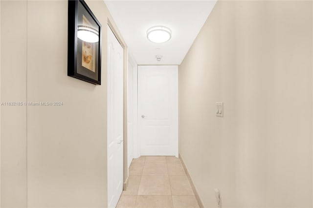 hallway with light tile patterned flooring