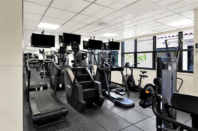 gym featuring a paneled ceiling