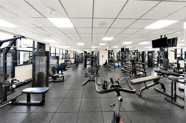 gym featuring a paneled ceiling