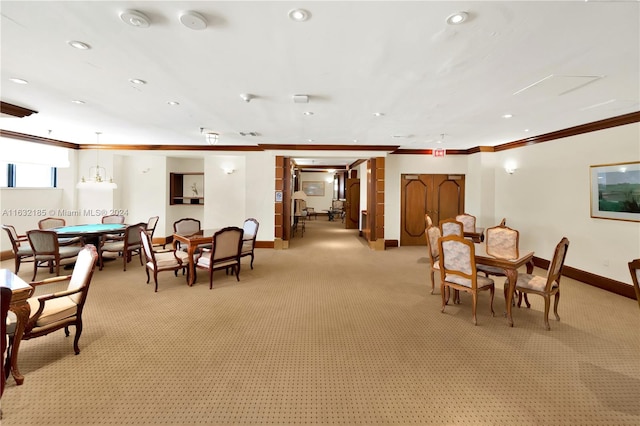 carpeted dining space featuring ornamental molding