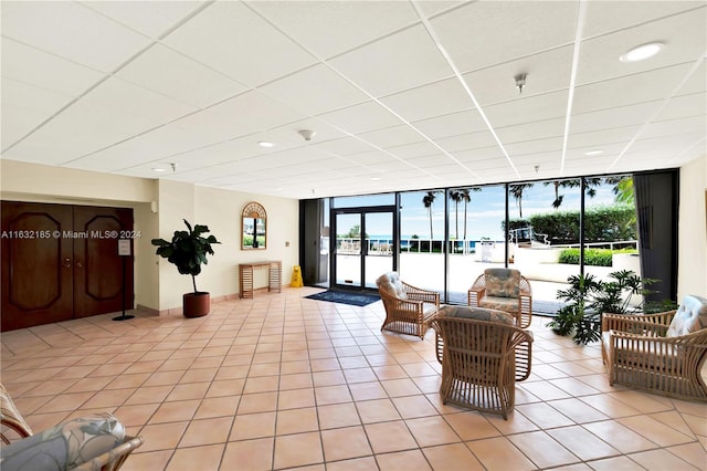 5757 Collins Ave Unit 801, Miami Beach, FL 33140 - common area with floor to ceiling windows, a drop ceiling, and recessed lighting
