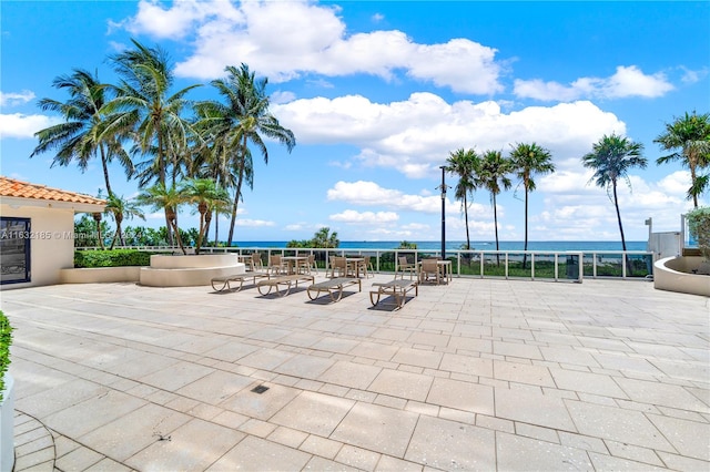 view of patio featuring a water view