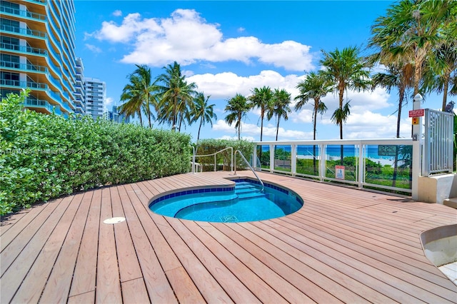 view of swimming pool with a deck