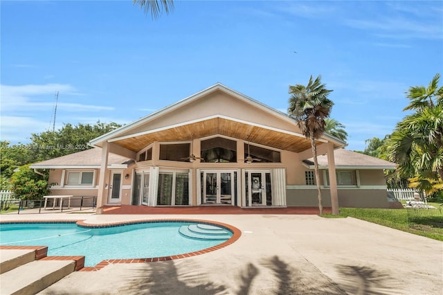 view of swimming pool featuring a patio area and ceiling fan