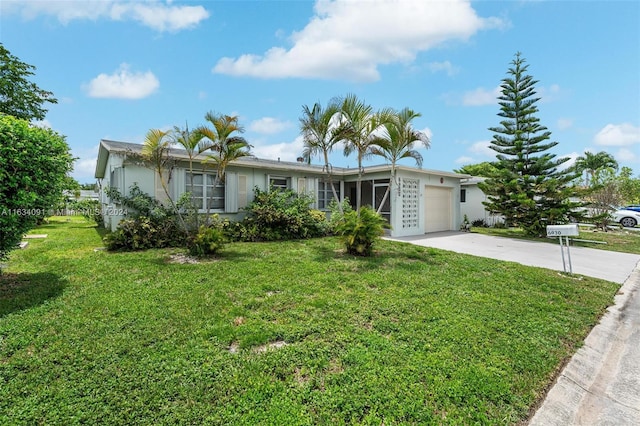 single story home featuring a garage and a front yard